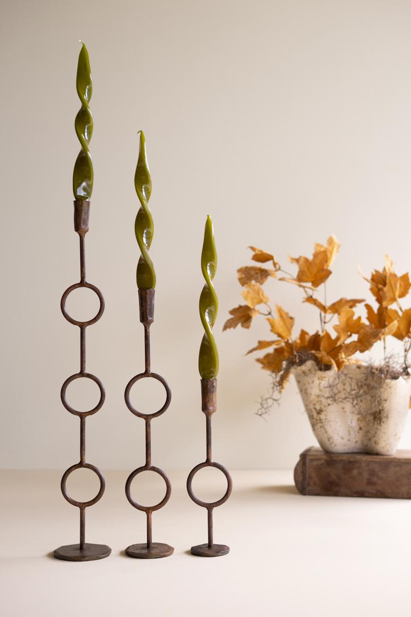 Brass taper holders with candles