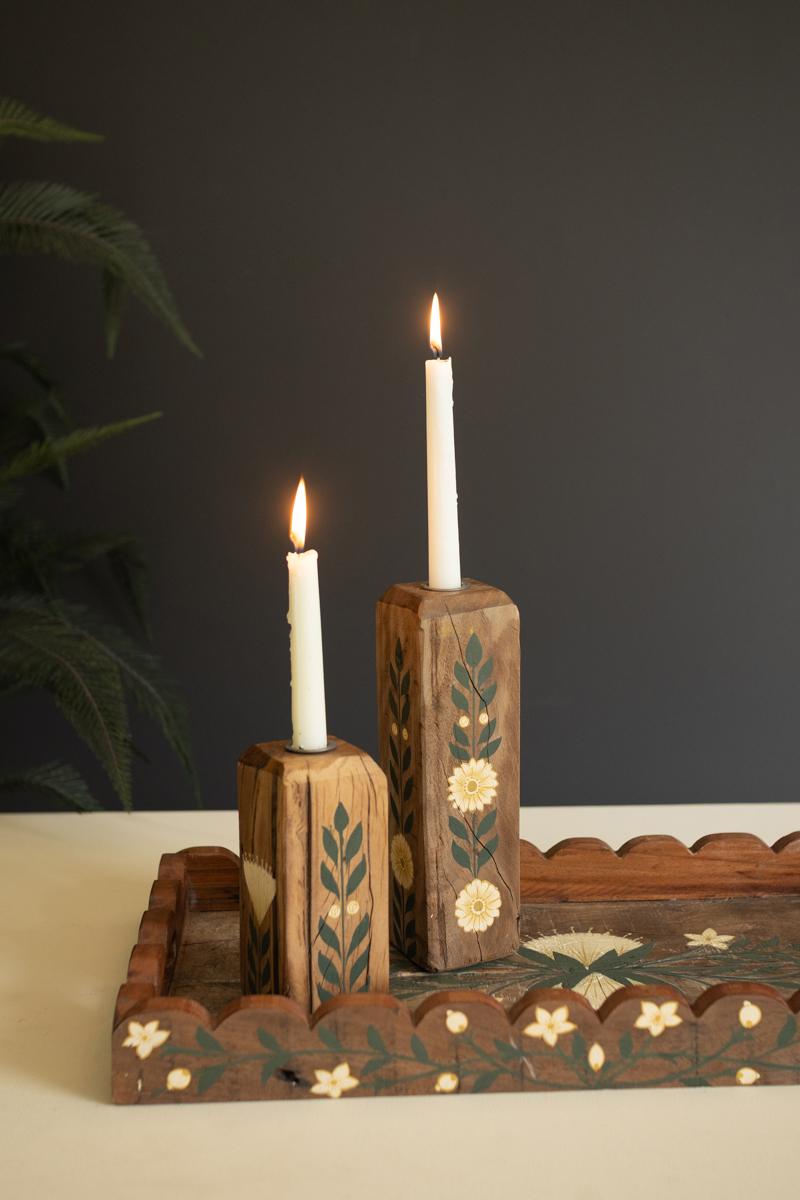 Taper candle holders with candles