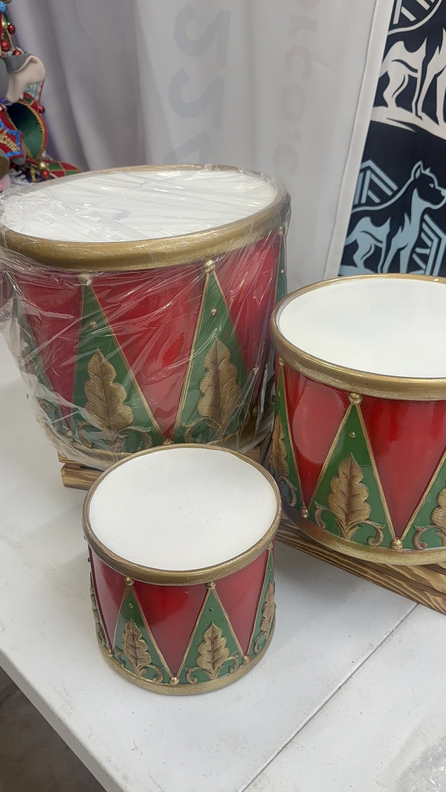 Red, green and gold nesting drum risers, set of 3