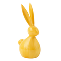 Yellow rabbit-shaped object on a white background