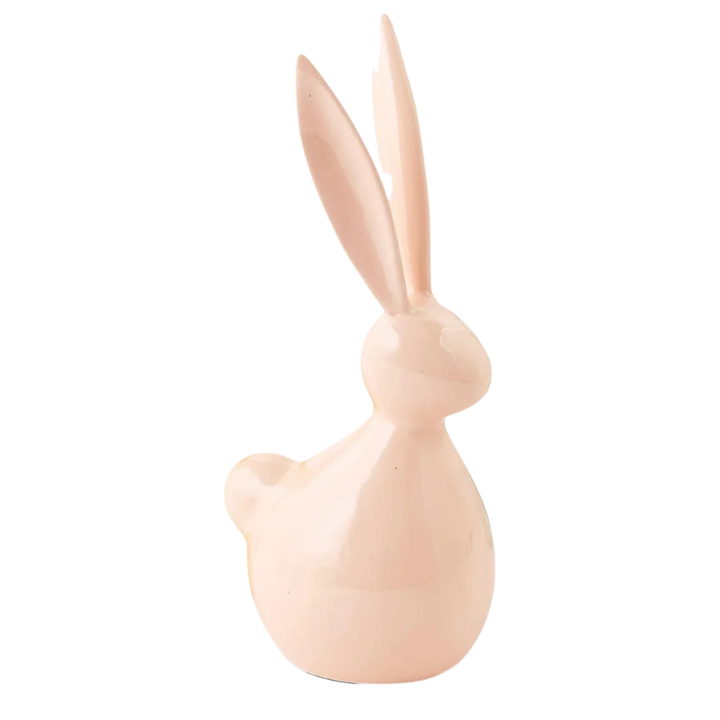 Pink rabbit-shaped decorative item on a white background