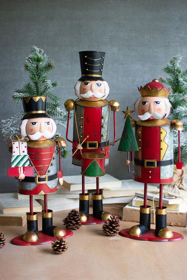 Set of three hand-painted distressed metal nutcracker figures