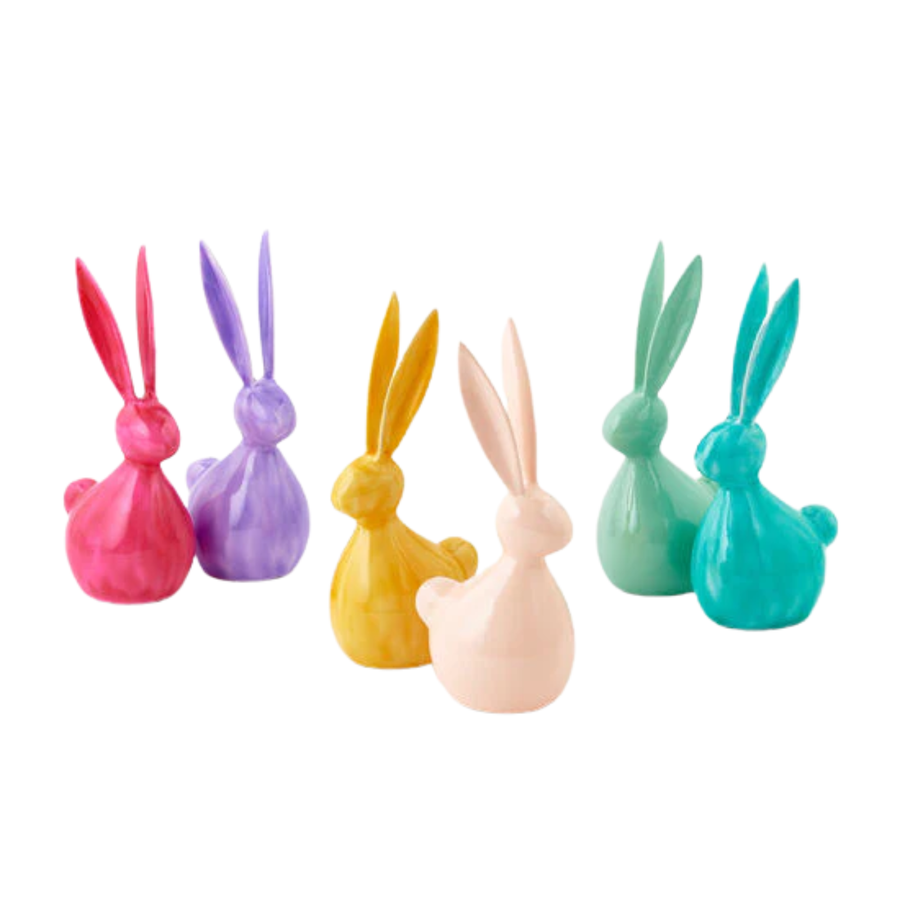 Set of colorful rabbit-shaped objects on a white background