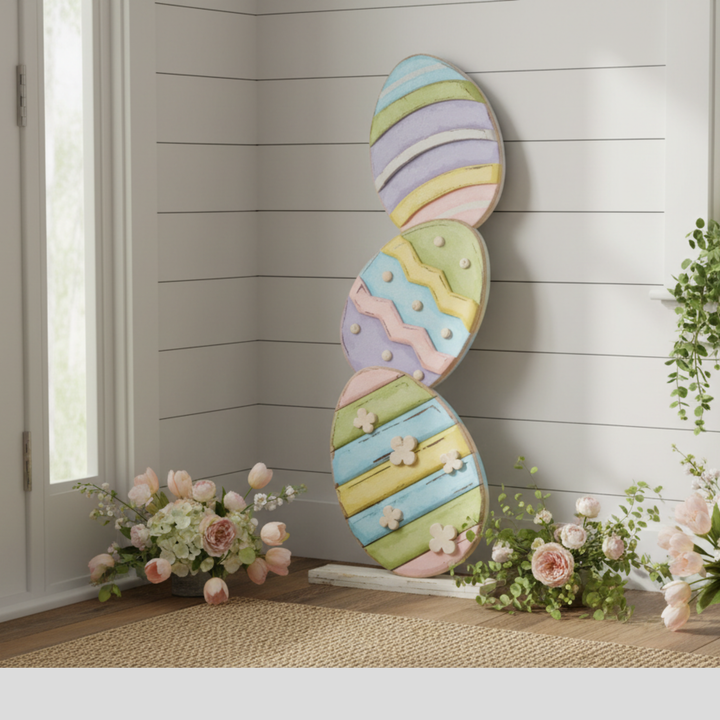 Decorative Easter egg wall art with pastel colors on a wooden floor.