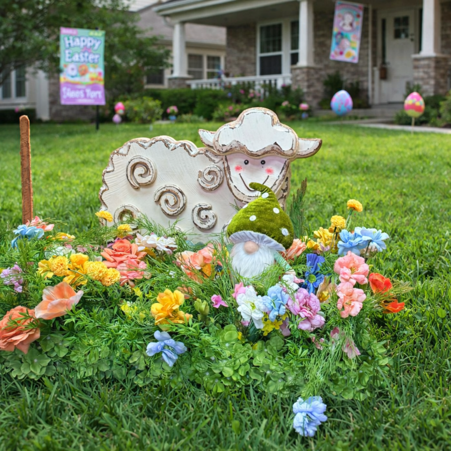 Decorative Easter scene with sheep, gnome, and flowers in a front yard.