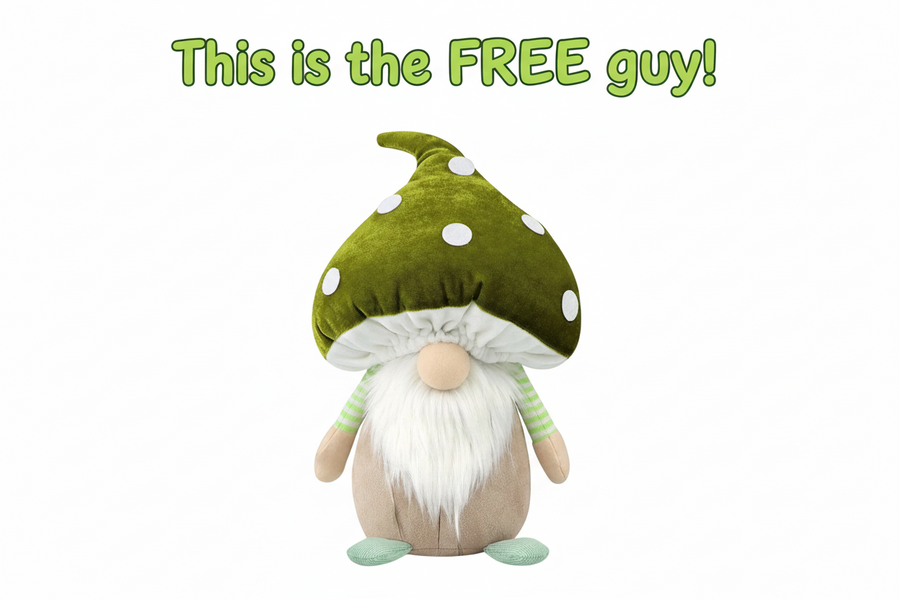 Stuffed gnome toy with a green polka dot mushroom hat on a white background