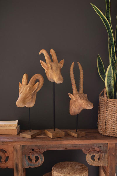Set of three carved mango wood animal heads: ram, antelope and gazelle