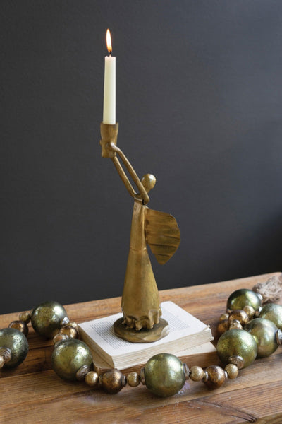Brass and glass Christmas angel candle holders styled for holiday decor