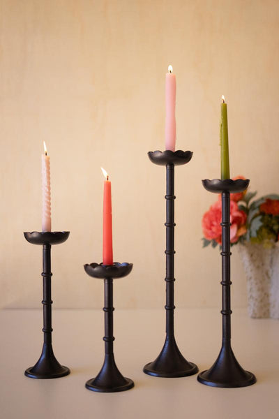 Set of four black cast aluminum flower taper candle holders