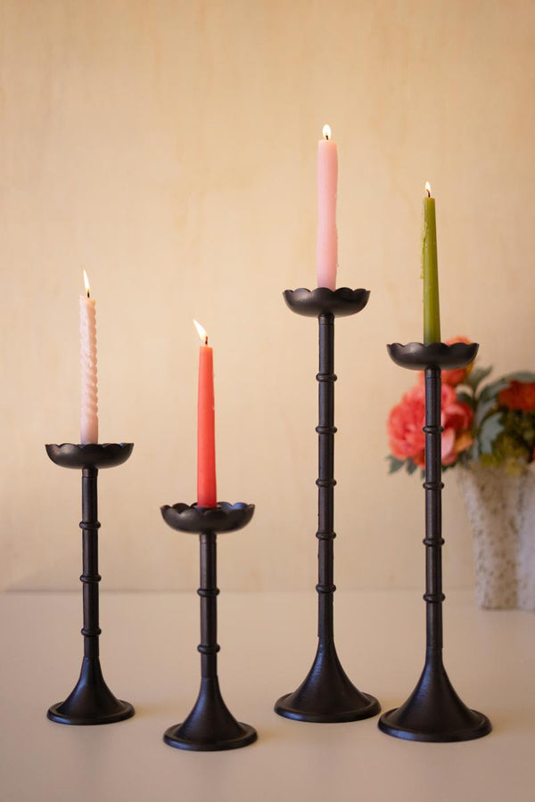 Set of four black cast aluminum flower taper candle holders