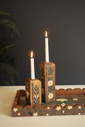 Taper candle holders with candles