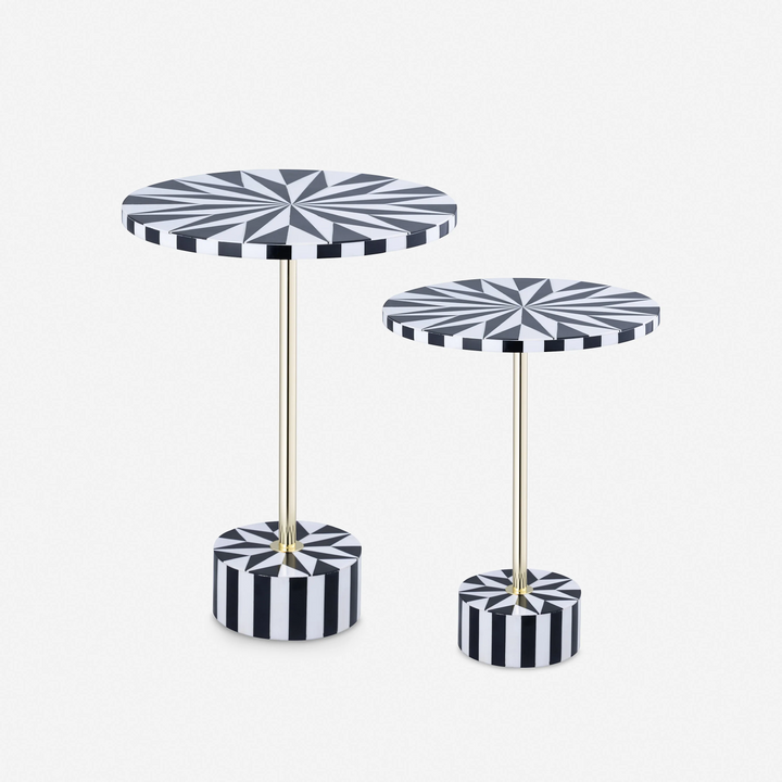 Two black and white patterned side tables on a white background