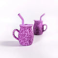 Set of two purple Talavera silicone baby training mugs with straw lids