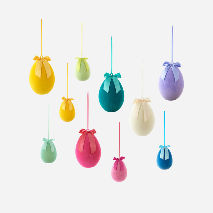 Colorful hanging Easter egg decorations on a white background