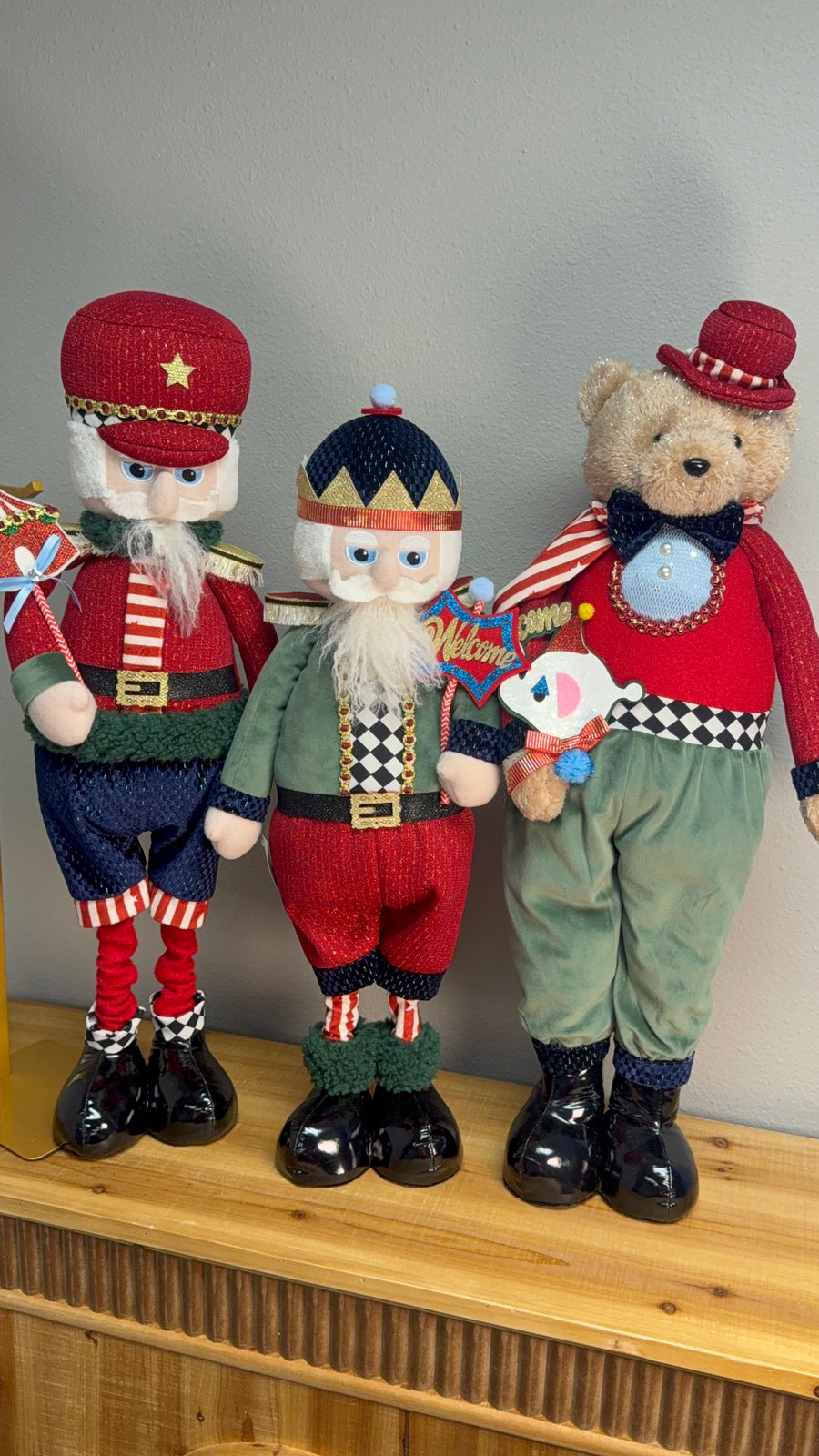 Circus Christmas plush figures: Santa soldier, ringmaster Santa with Welcome sign and tan circus bear in red bowler hat