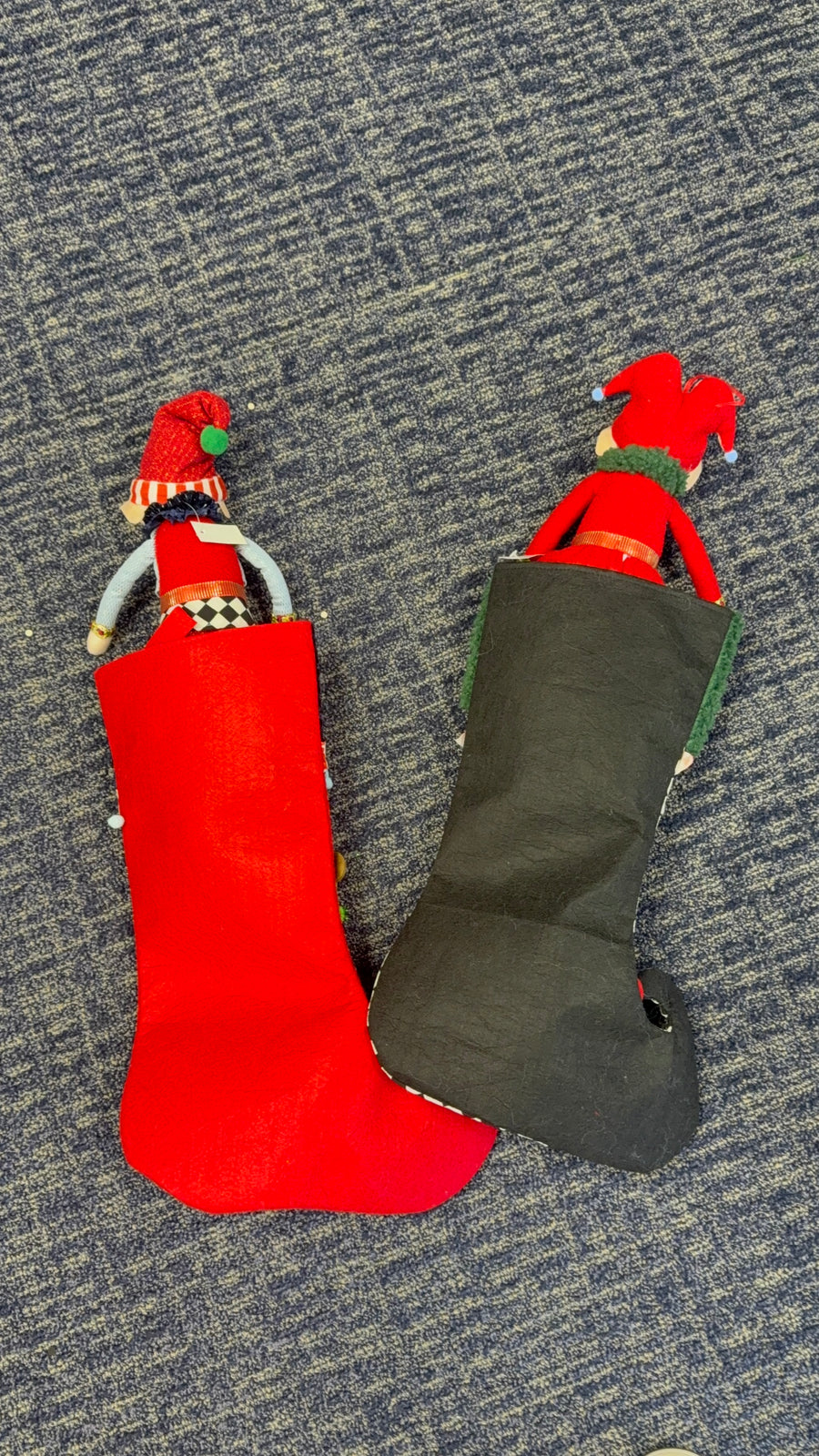 Whimsical elf Christmas stockings set of 2: red felt stocking with plush elf and black jester elf stocking