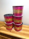 Hot pink and gold sequin wired ribbon rolls, bright product photo