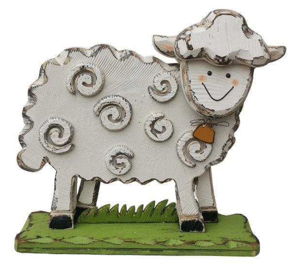 Decorative sheep figurine with a smiling face on a white background