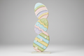 Decorative item with pastel-colored stripes on a gray background