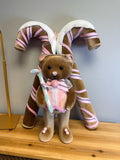 Pink Christmas decor set: brown velvet teddy bear in pink lace bib with two large velvet candy canes wrapped in pink ribbon