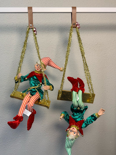 Two posable green velvet elves on gold tinsel-rope swings, a whimsical Christmas tree decoration