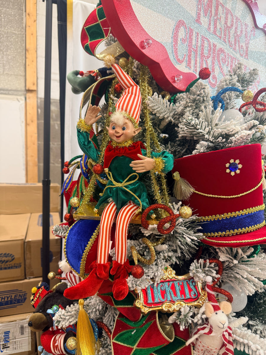 Swinging elves hanging on a circus Christmas tree