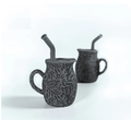 Set of two black Talavera silicone baby training mugs with straw lids